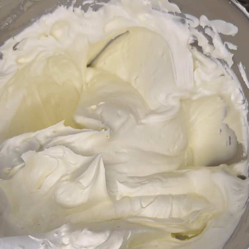 Tallow being stirred in a mixing bowl showing a fluffy, whipped texture.
